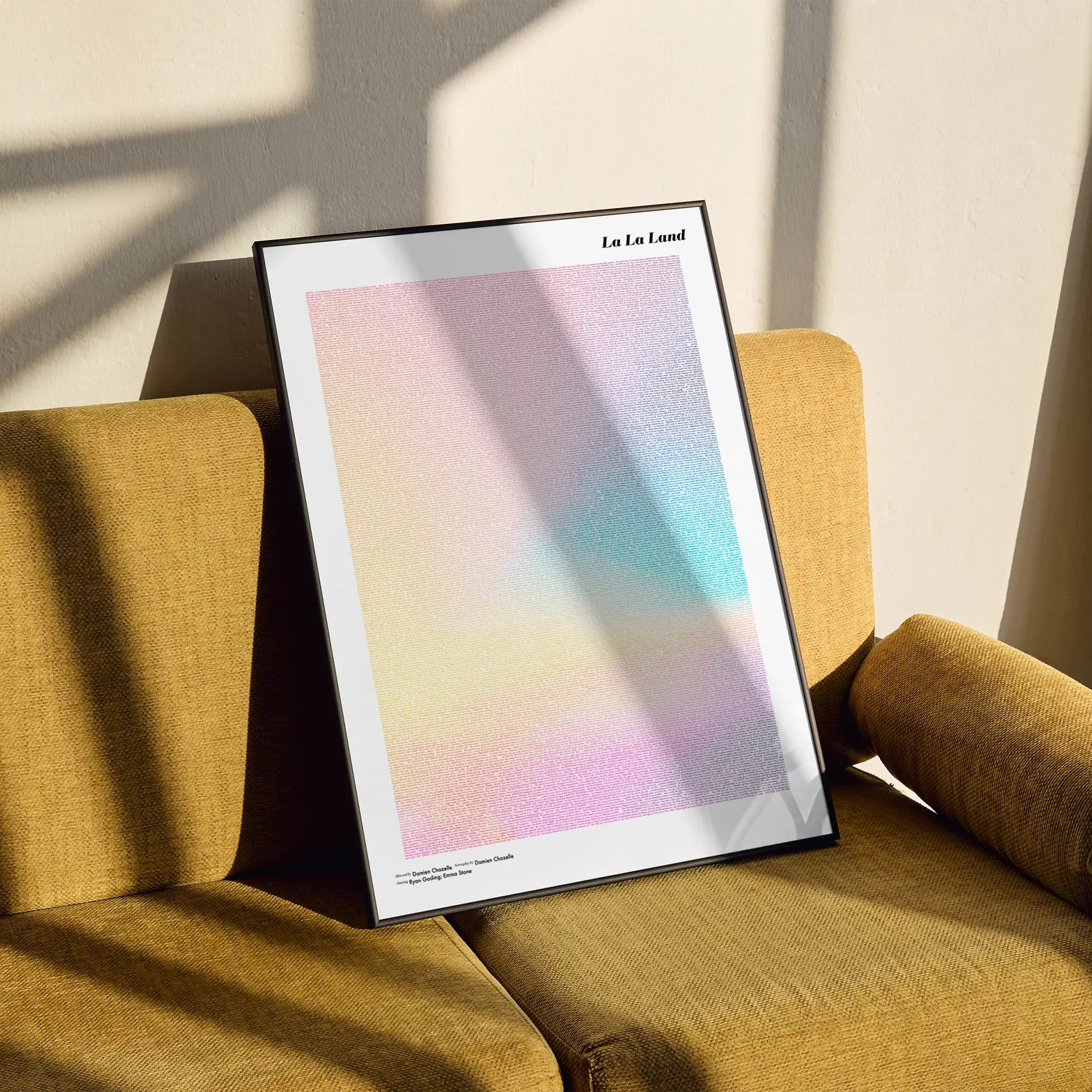 A framed La La Land movie script poster styled in a clean interior setting.