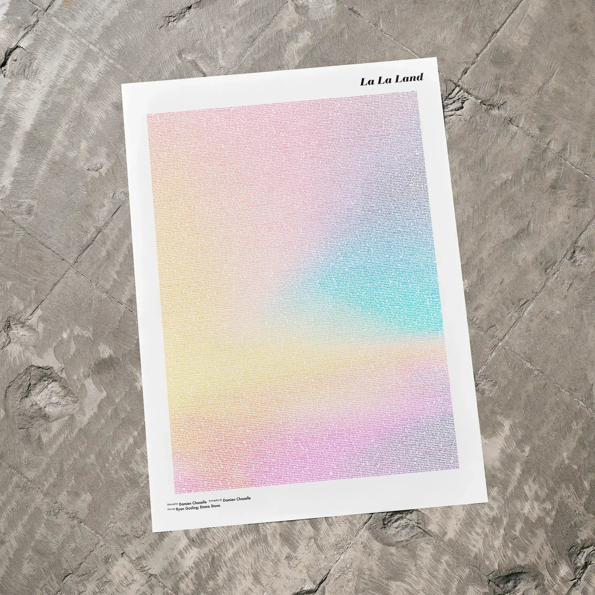 A La La Land movie script poster laid flat on a textured floor surface.