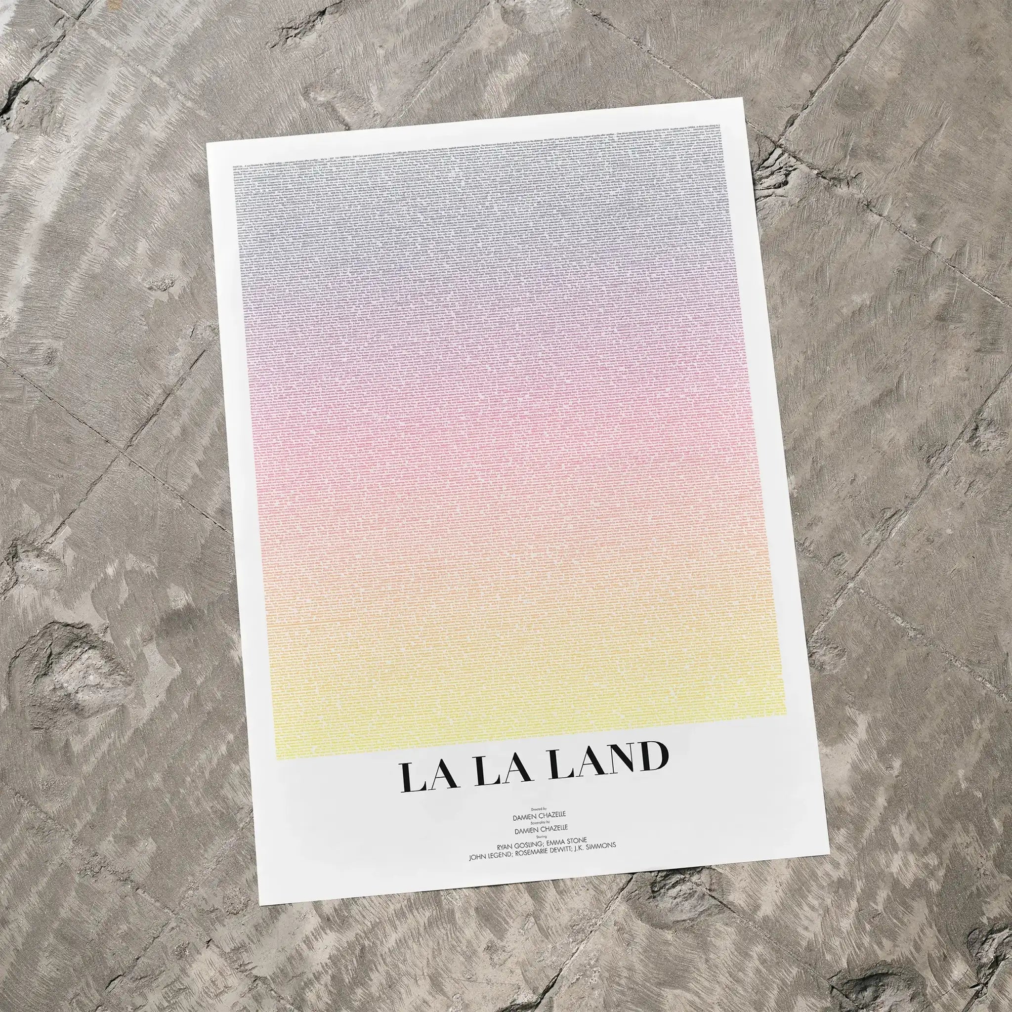 A La La Land movie script poster laid flat on a textured floor surface.