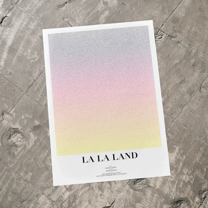 A La La Land movie script poster laid flat on a textured floor surface.