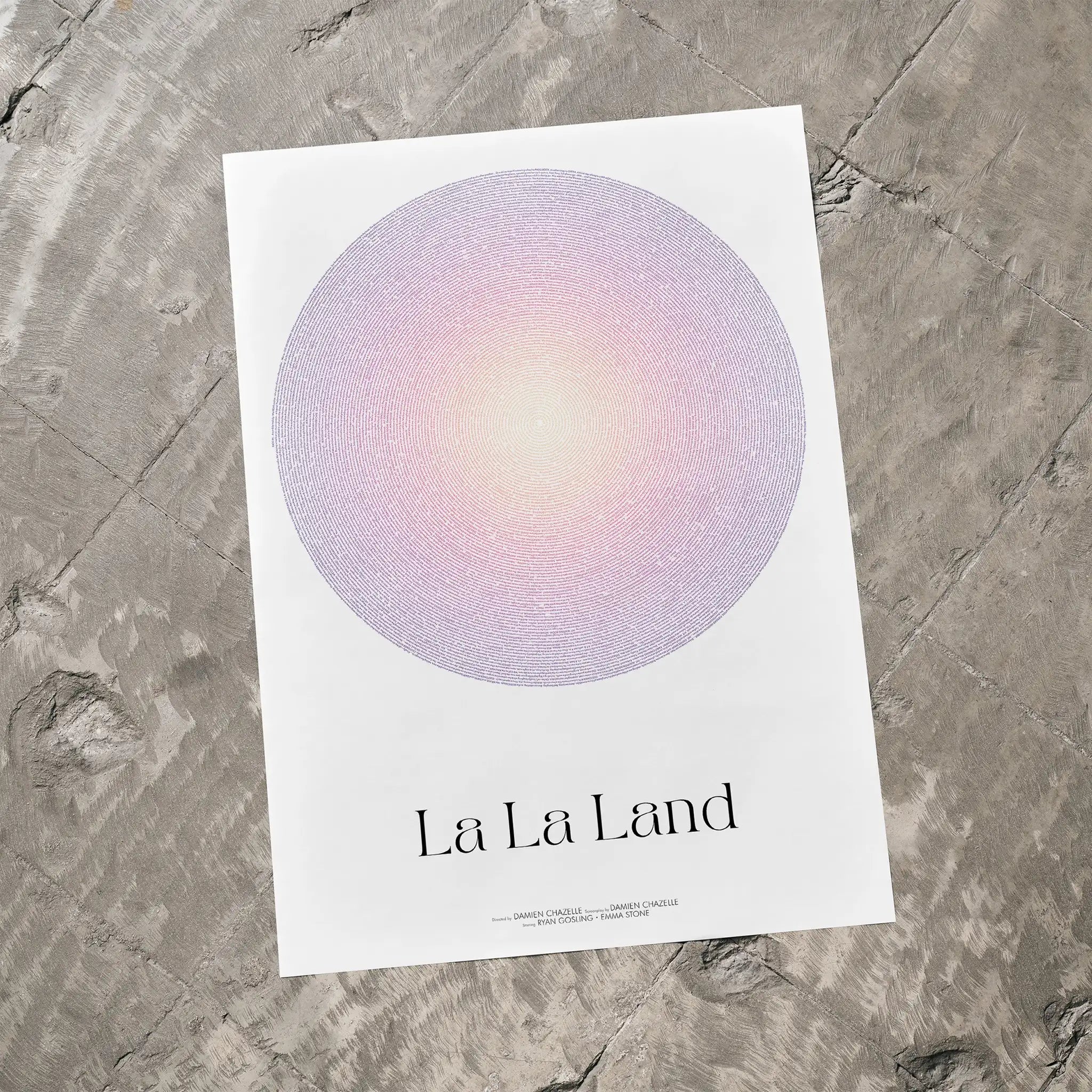 A La La Land movie script poster laid flat on a textured floor surface.