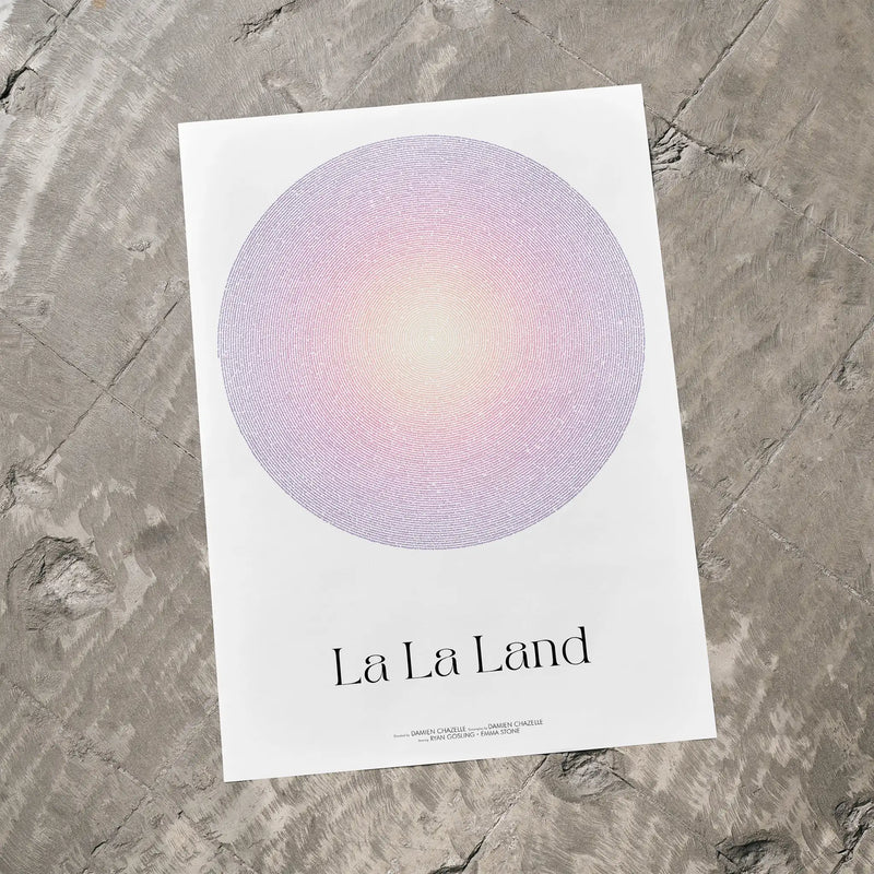 A La La Land movie script poster laid flat on a textured floor surface.
