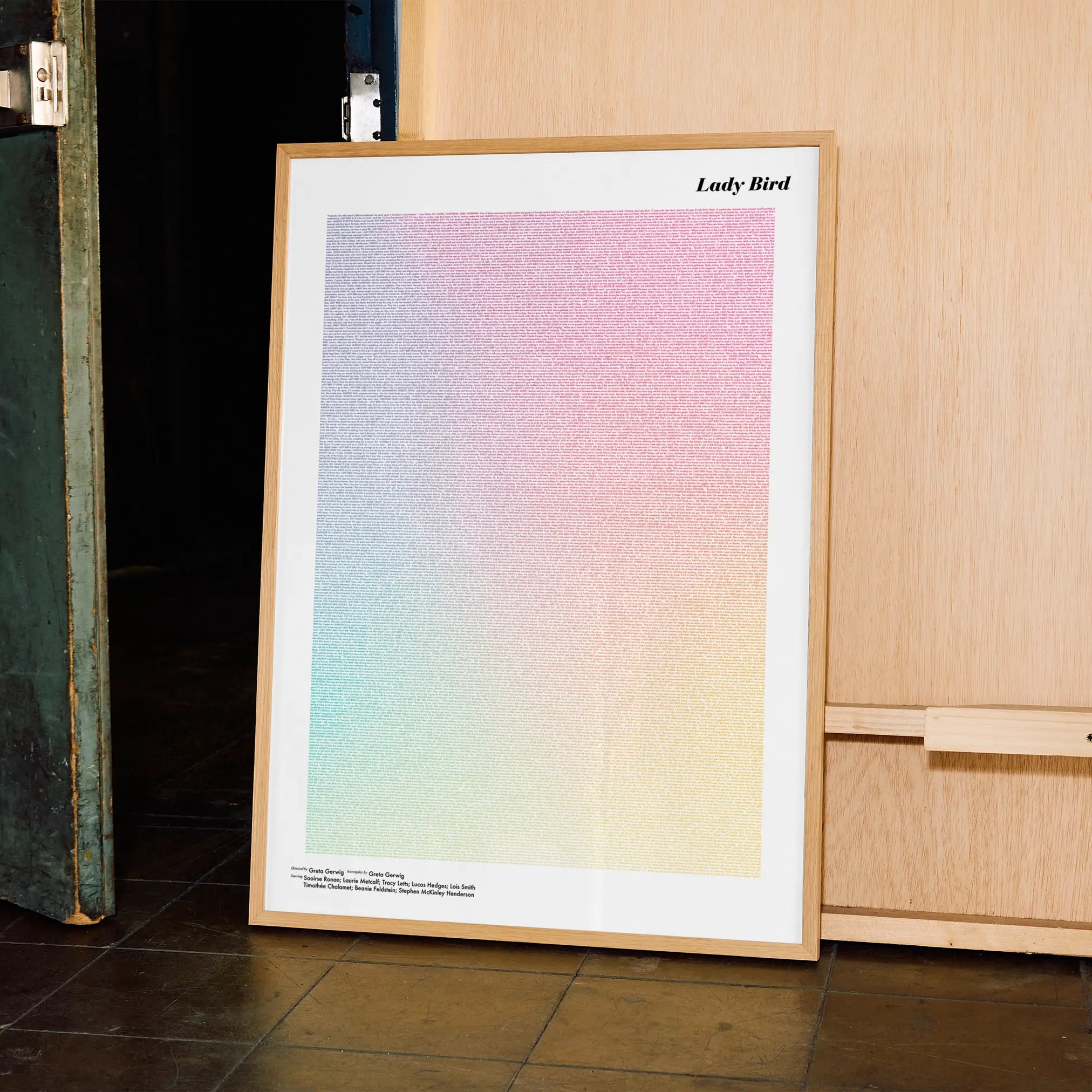 A framed Lady Bird movie script poster displayed in a contemporary interior setting.