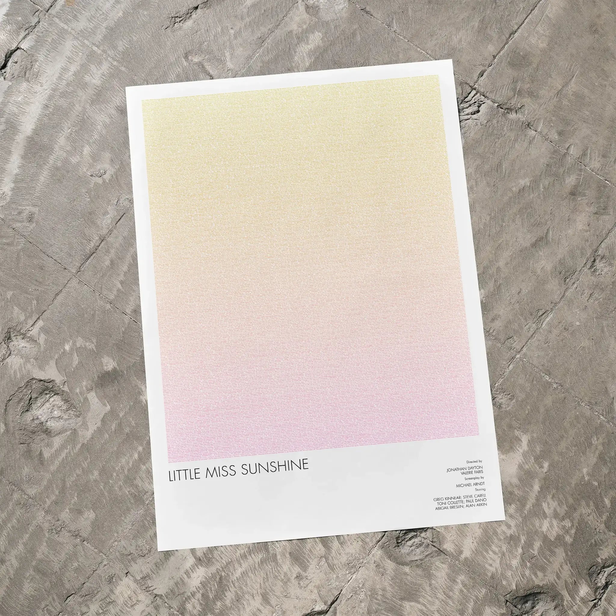 A Little Miss Sunshine movie script poster laid flat on a textured floor surface.