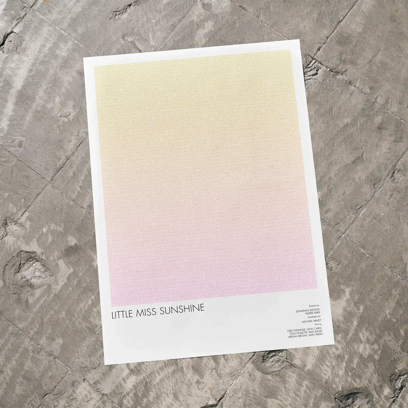 A Little Miss Sunshine movie script poster laid flat on a textured floor surface.