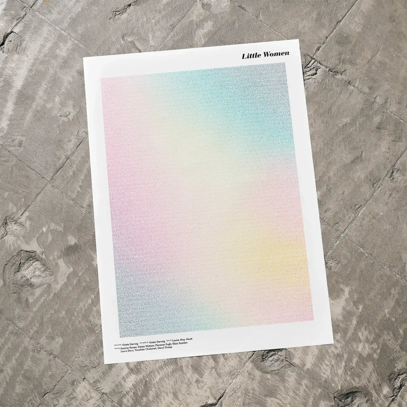 A Little Women movie script poster laid flat on a textured floor surface.
