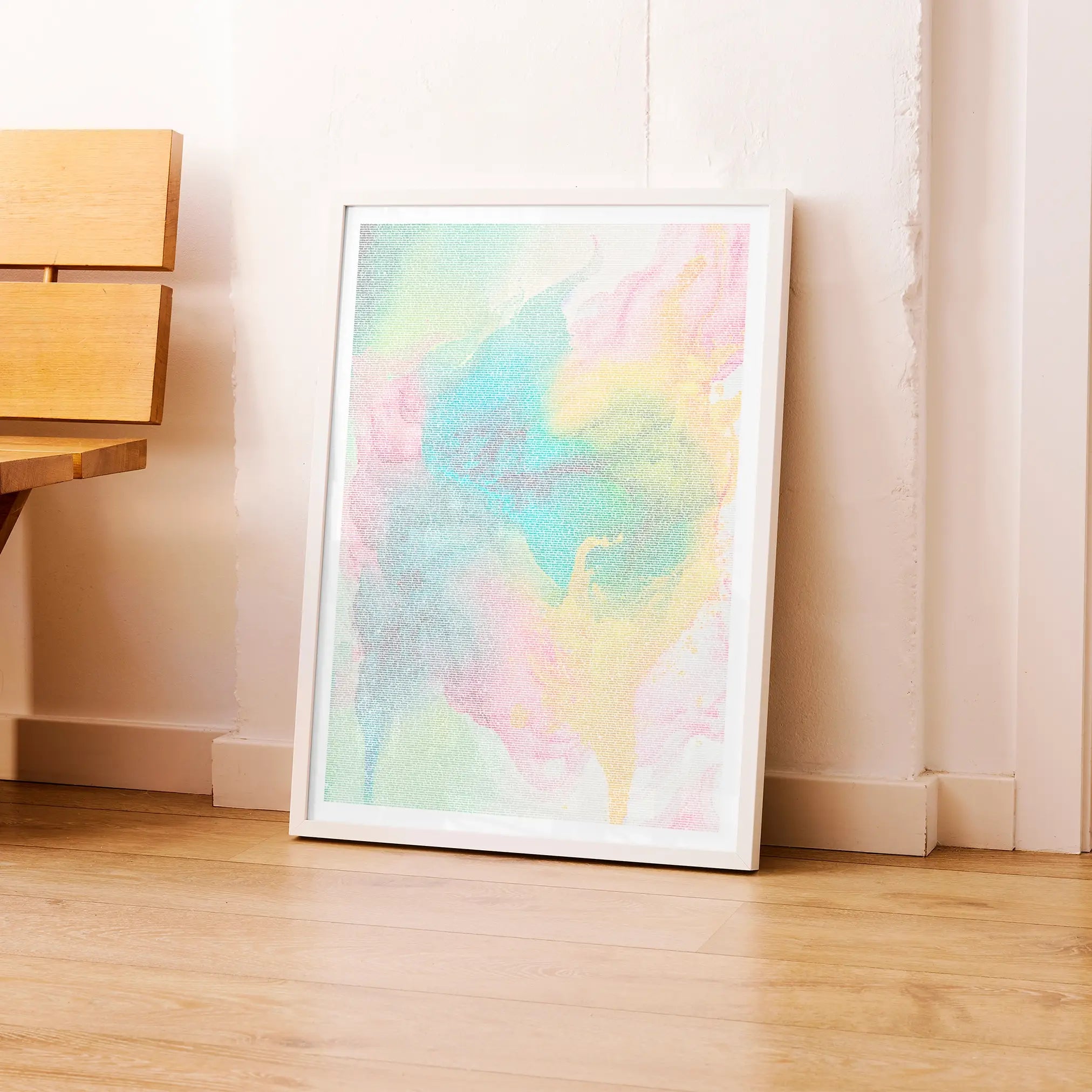 A framed Little Women movie script poster leaning against a wall in a modern interior.
