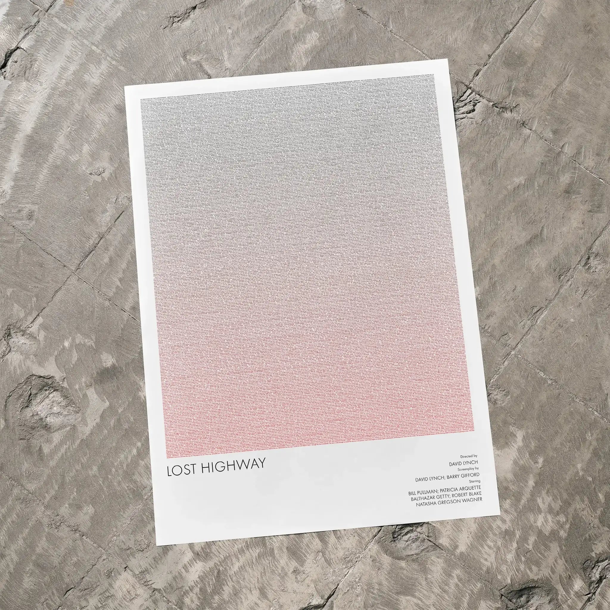A Lost Highway movie script poster laid flat on a textured floor surface.