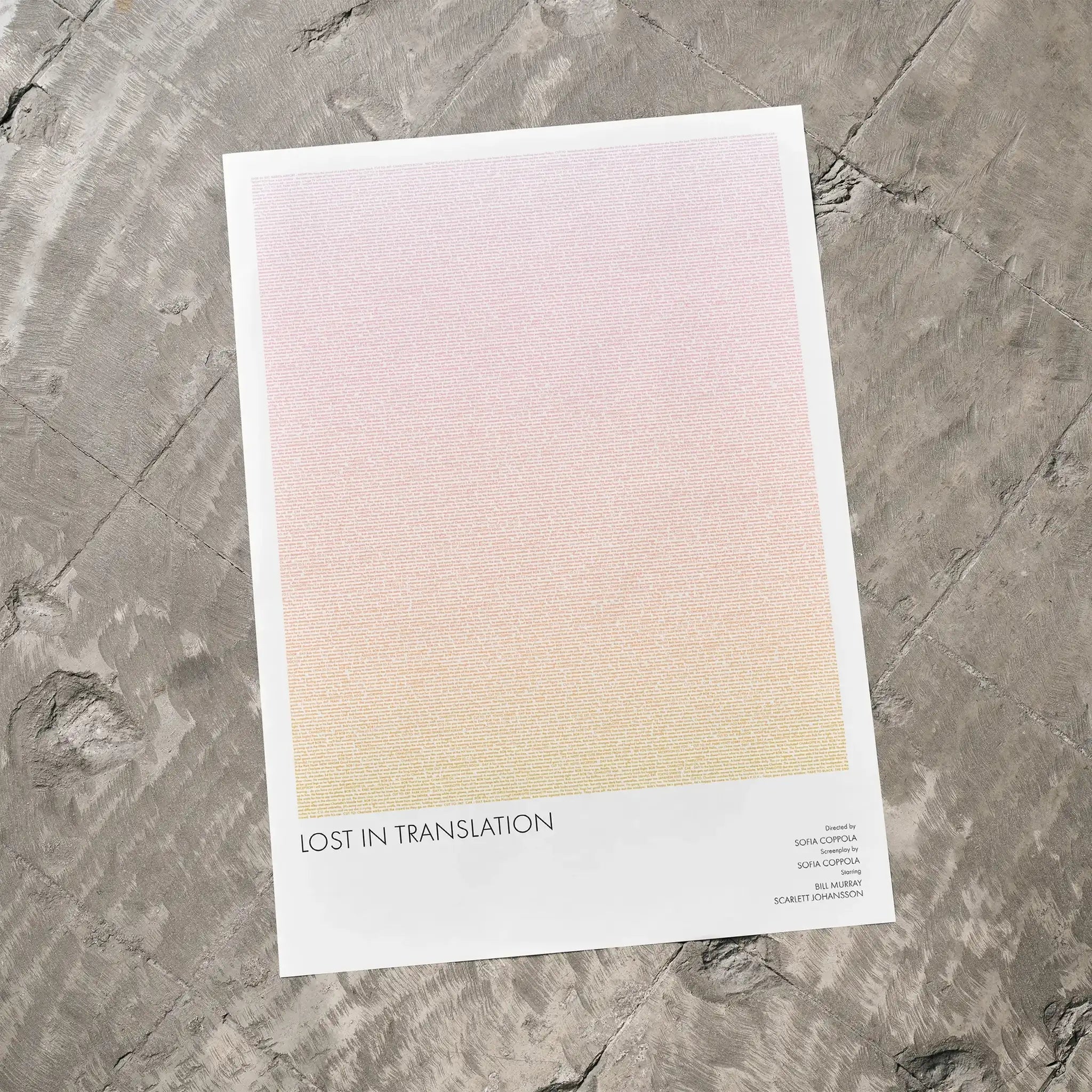 A Lost in Translation movie script poster laid flat on a textured floor surface.