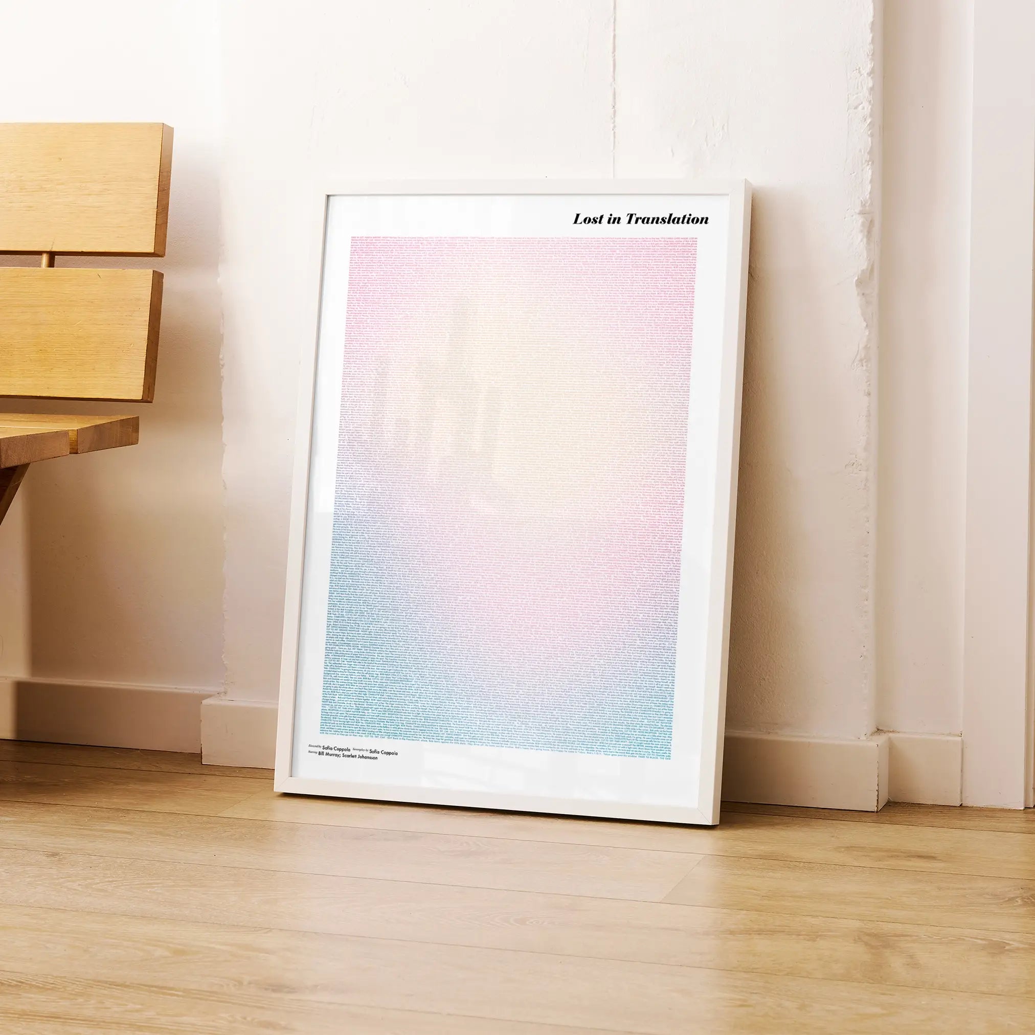A framed Lost in Translation movie script poster leaning against a wall in a modern interior.