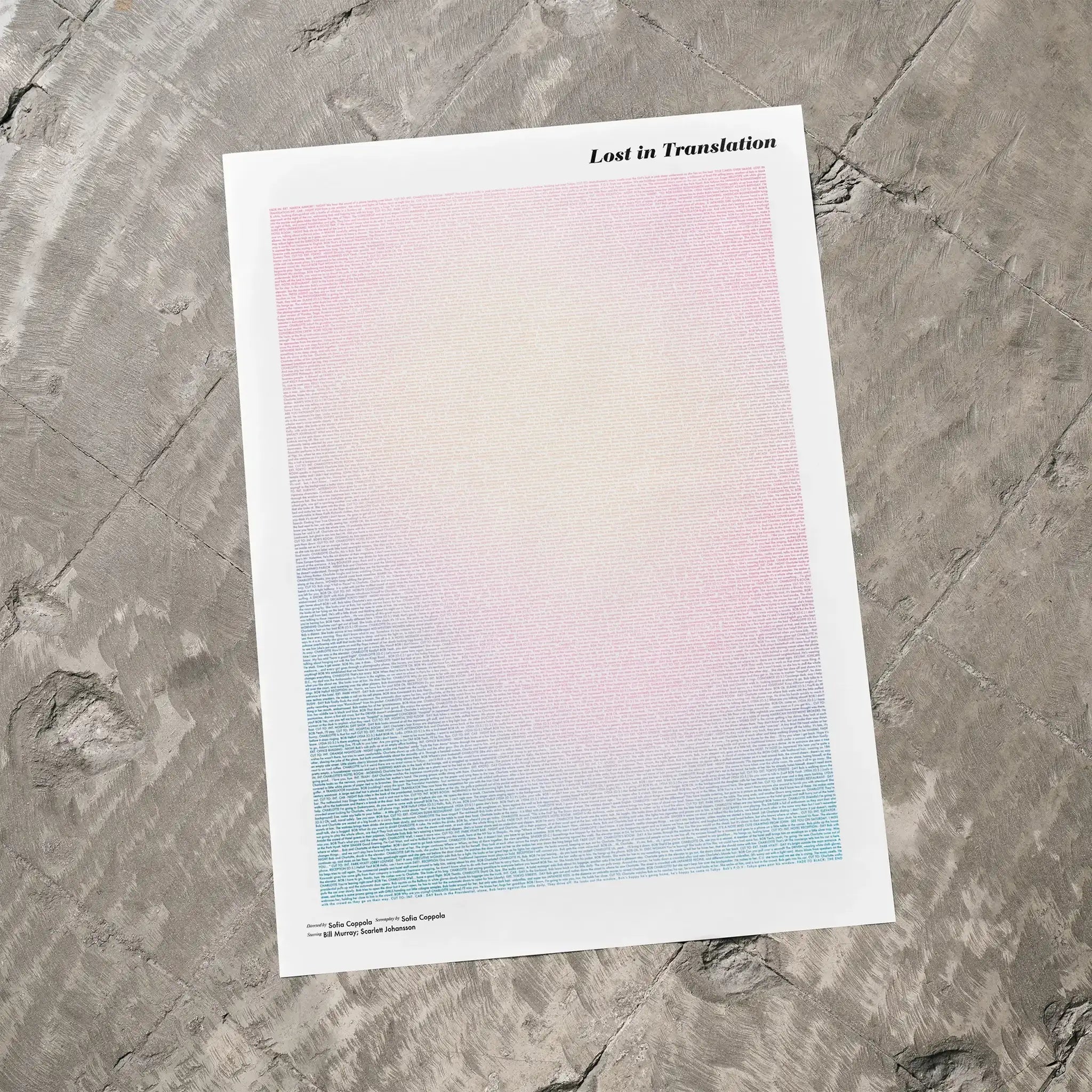 A Lost in Translation movie script poster laid flat on a textured floor surface.