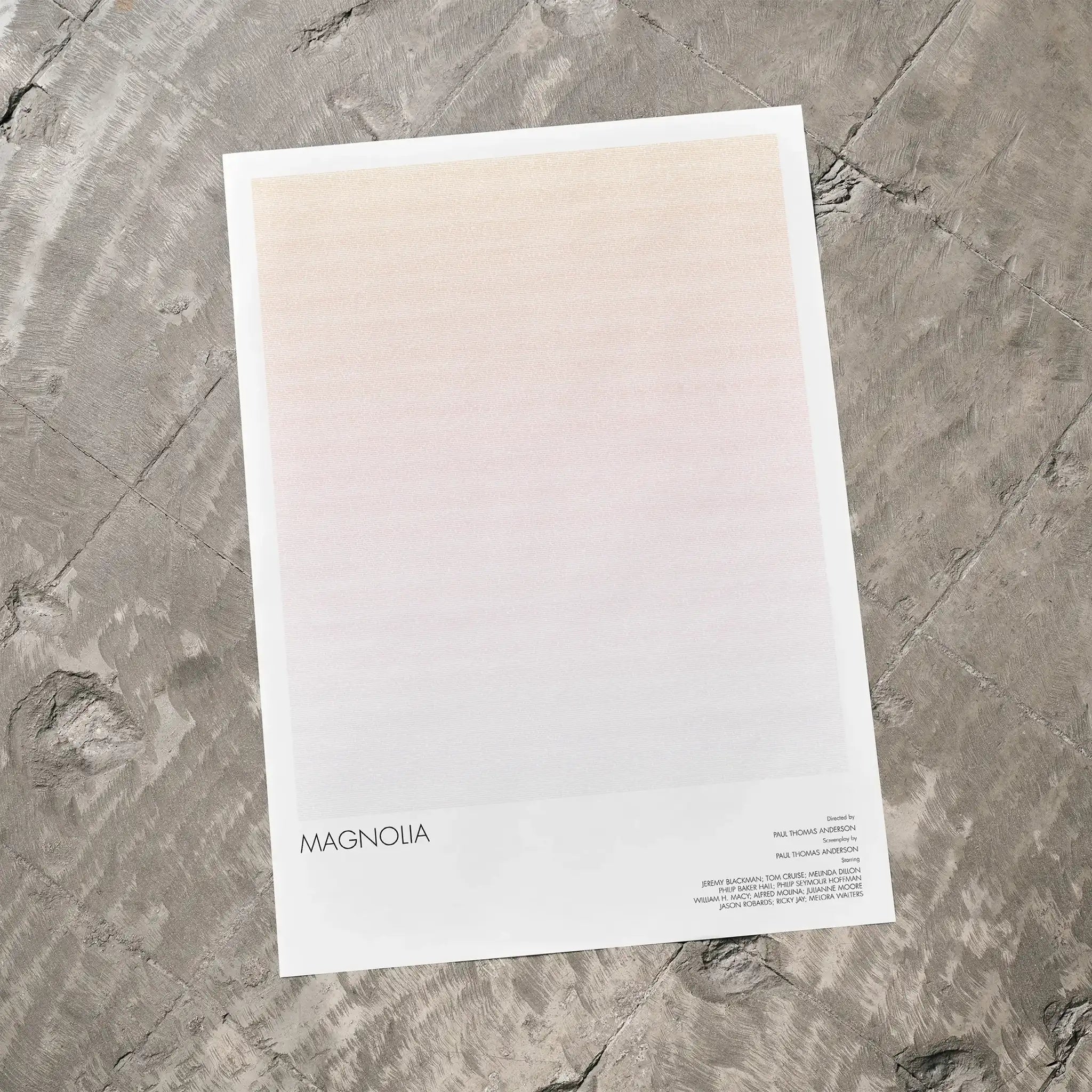 A Magnolia movie script poster laid flat on a textured floor surface.