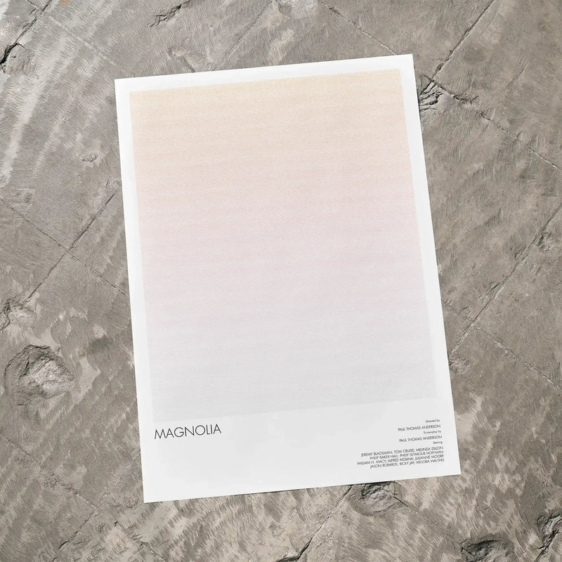 A Magnolia movie script poster laid flat on a textured floor surface.