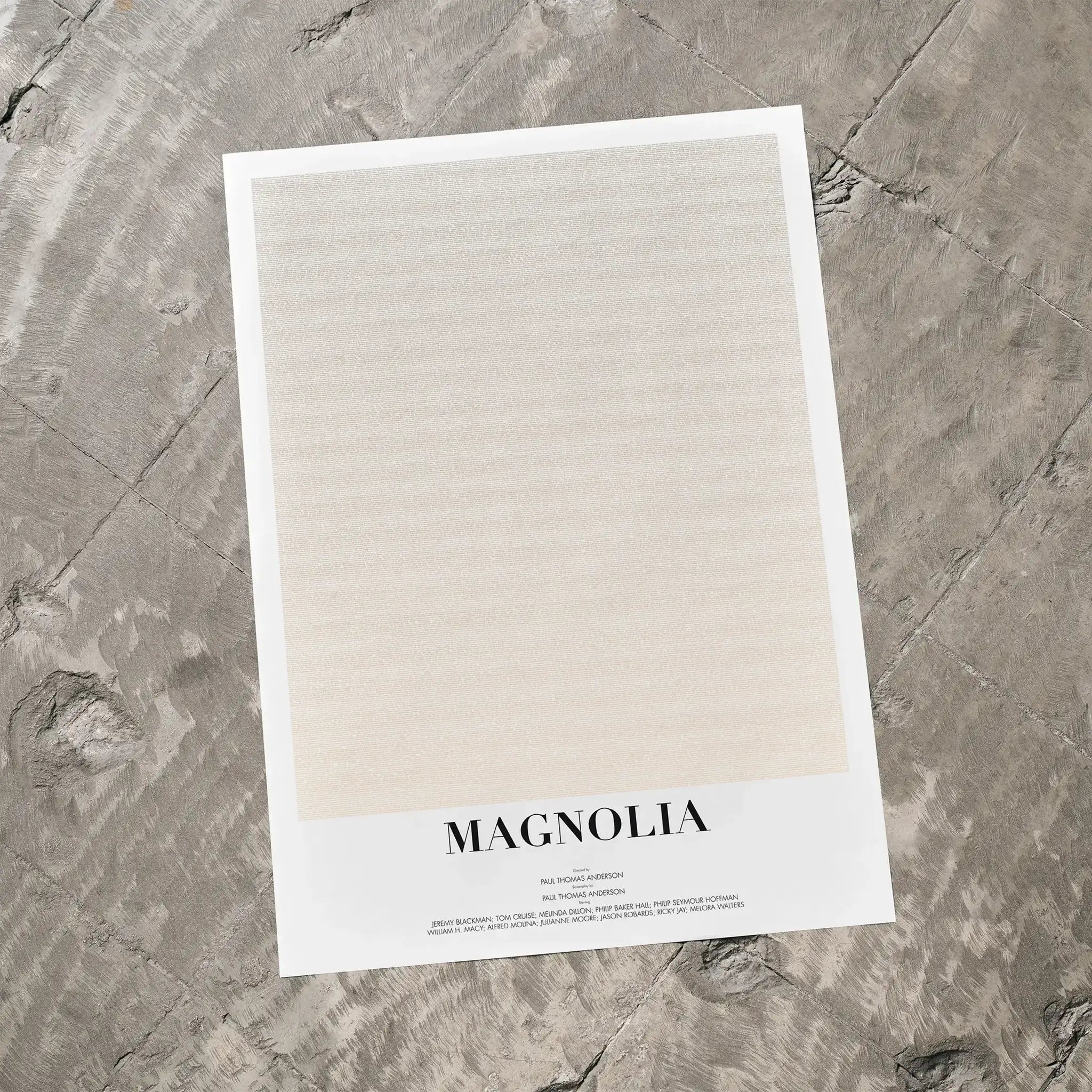 A Magnolia movie script poster laid flat on a textured floor surface.