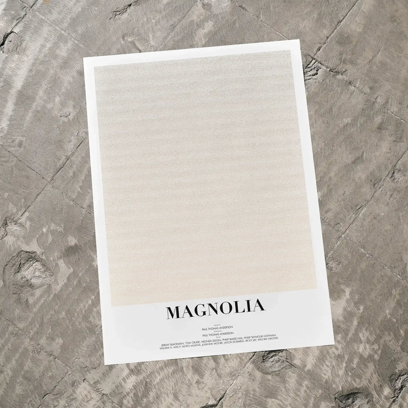 A Magnolia movie script poster laid flat on a textured floor surface.