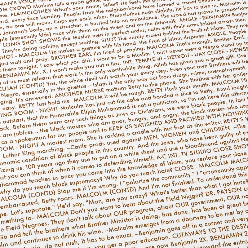 Close-up detail of the Malcolm X movie script poster showing dense typographic text.