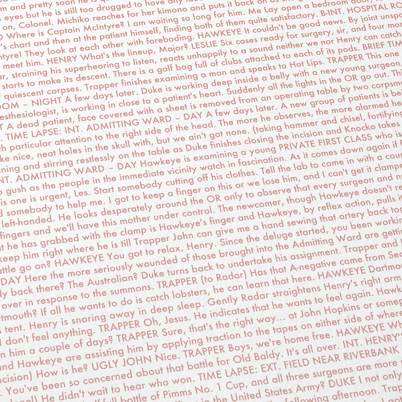 Close-up detail of the M*A*S*H movie script poster showing dense typographic text.