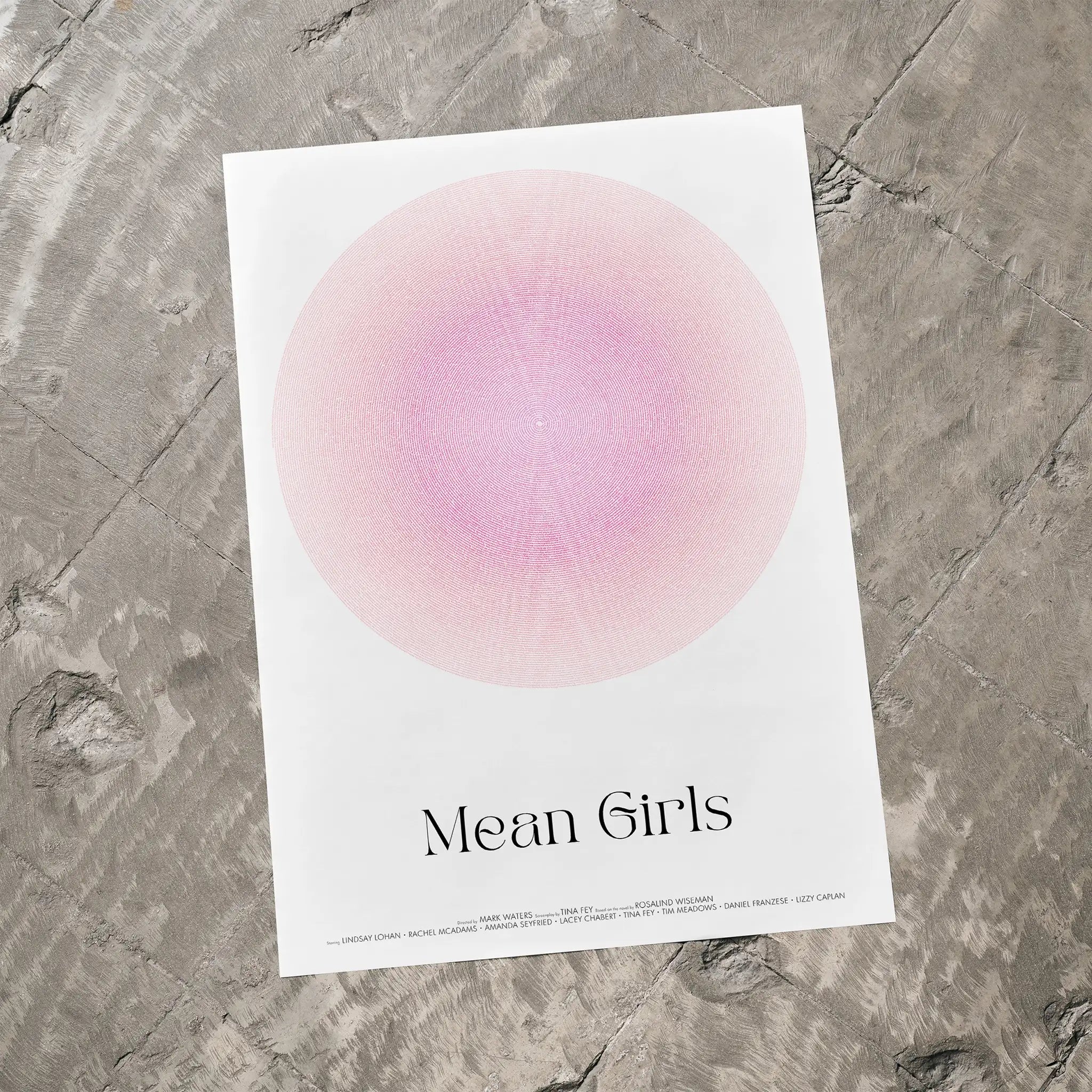 'Mean Girls' movie poster on a textured surface