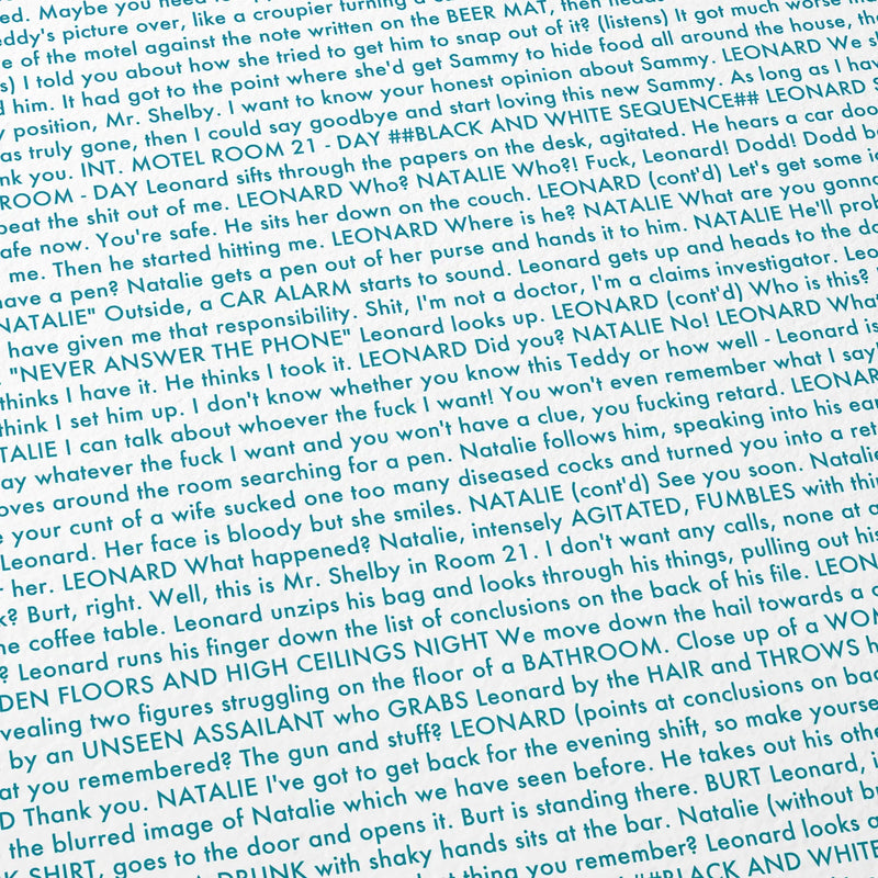 Close-up detail of the Memento movie script poster showing dense typographic text.