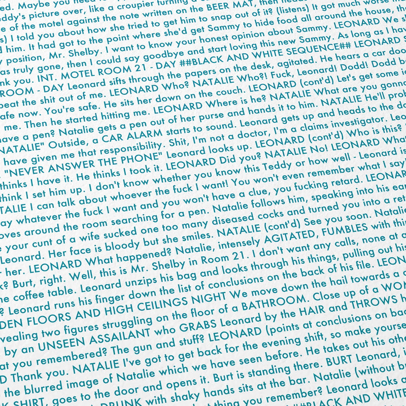 Close-up detail of the Memento movie script poster showing dense typographic text.