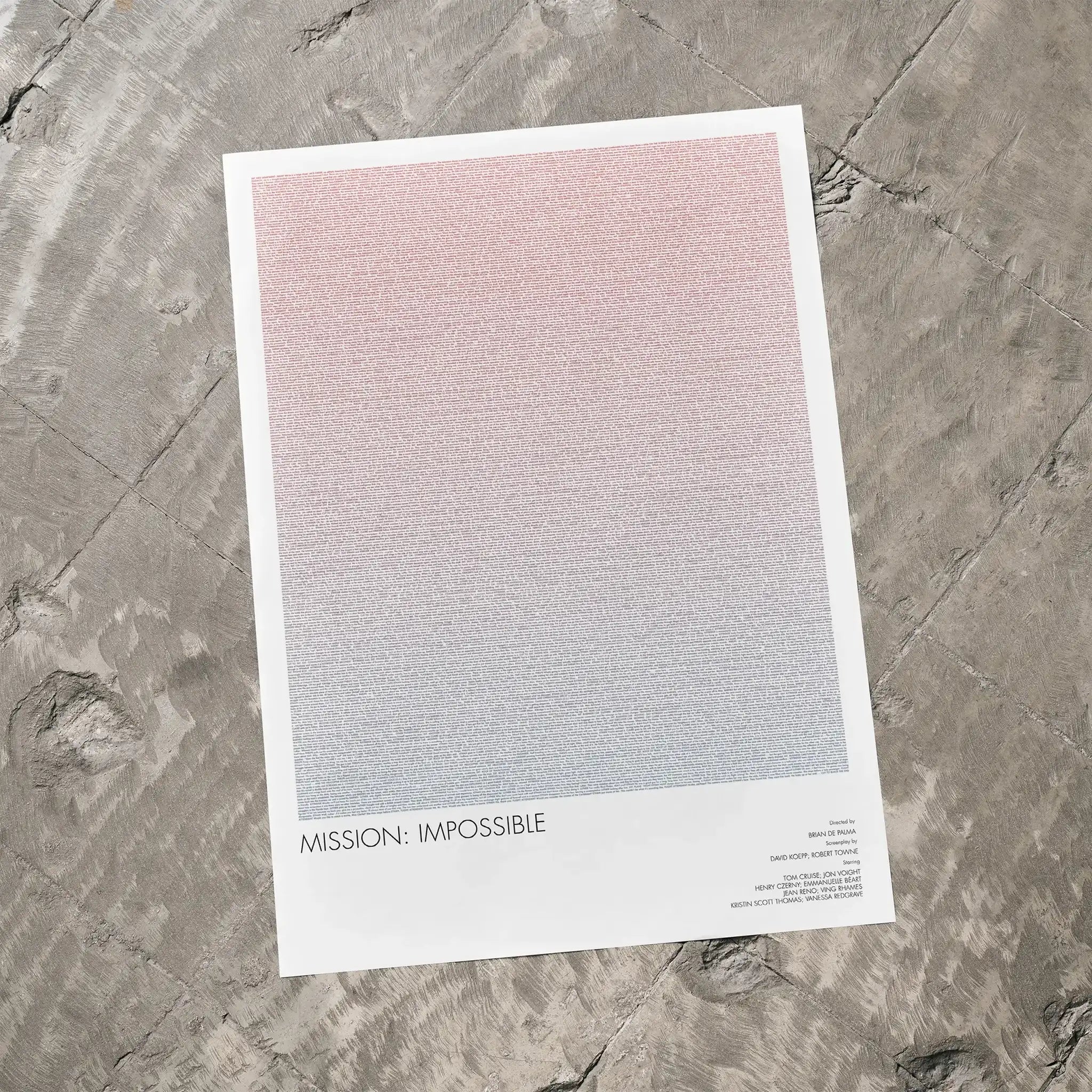 A Mission: Impossible movie script poster laid flat on a textured floor surface.