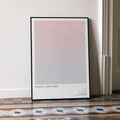 A framed Mission: Impossible movie script poster leaning against a wall in a minimalist interior.