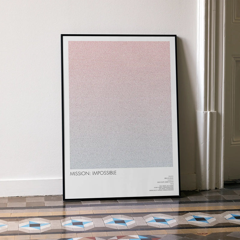 A framed Mission: Impossible movie script poster leaning against a wall in a minimalist interior.