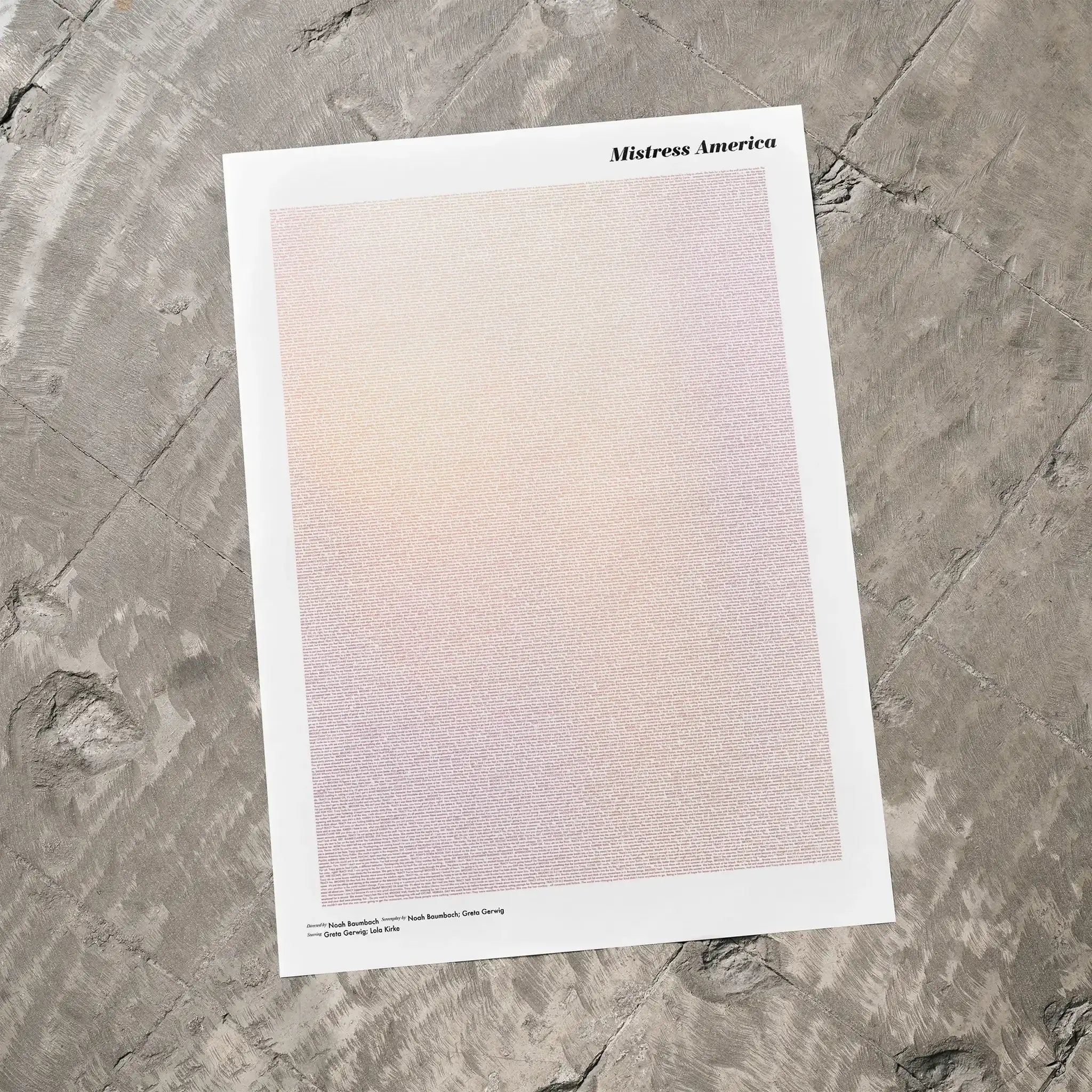 A Mistress America movie script poster laid flat on a textured floor surface.
