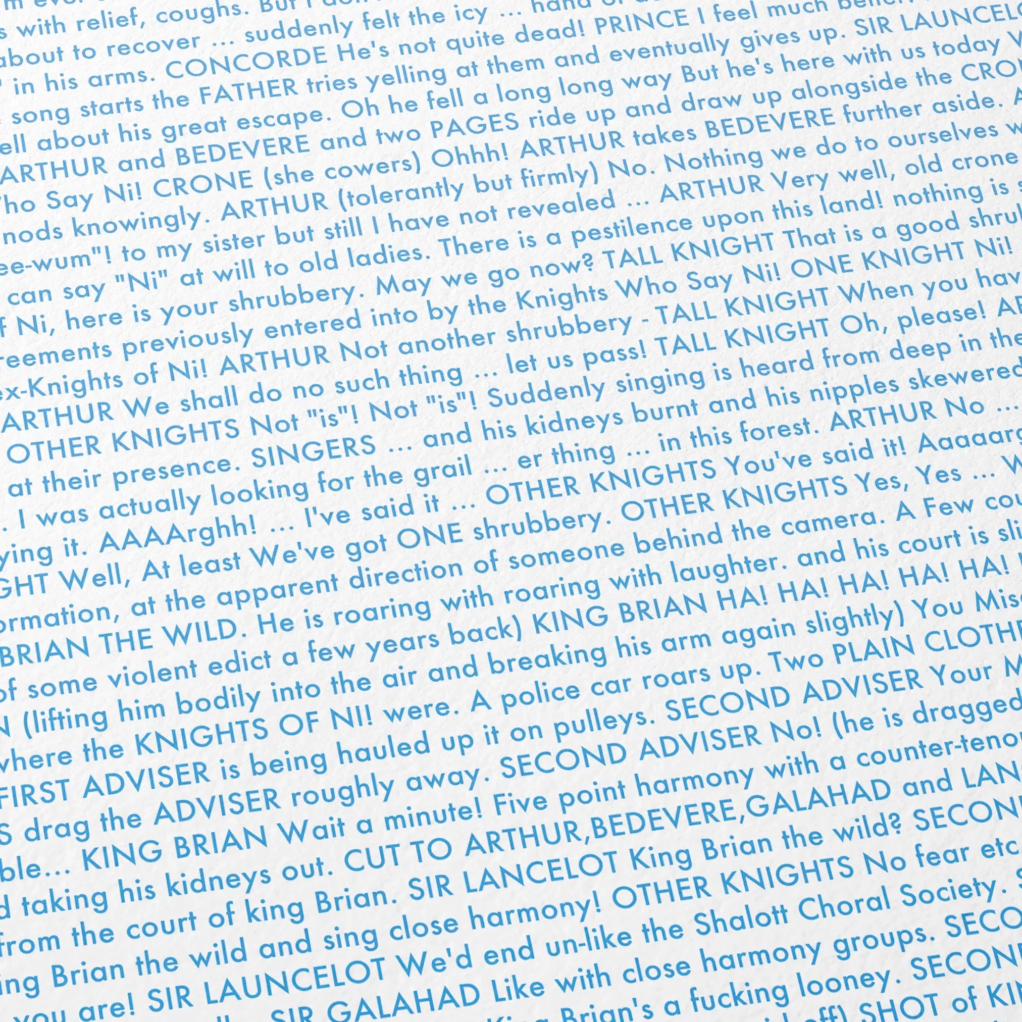 Close-up detail of the Monty Python and the Holy Grail movie script poster showing dense typographic text.