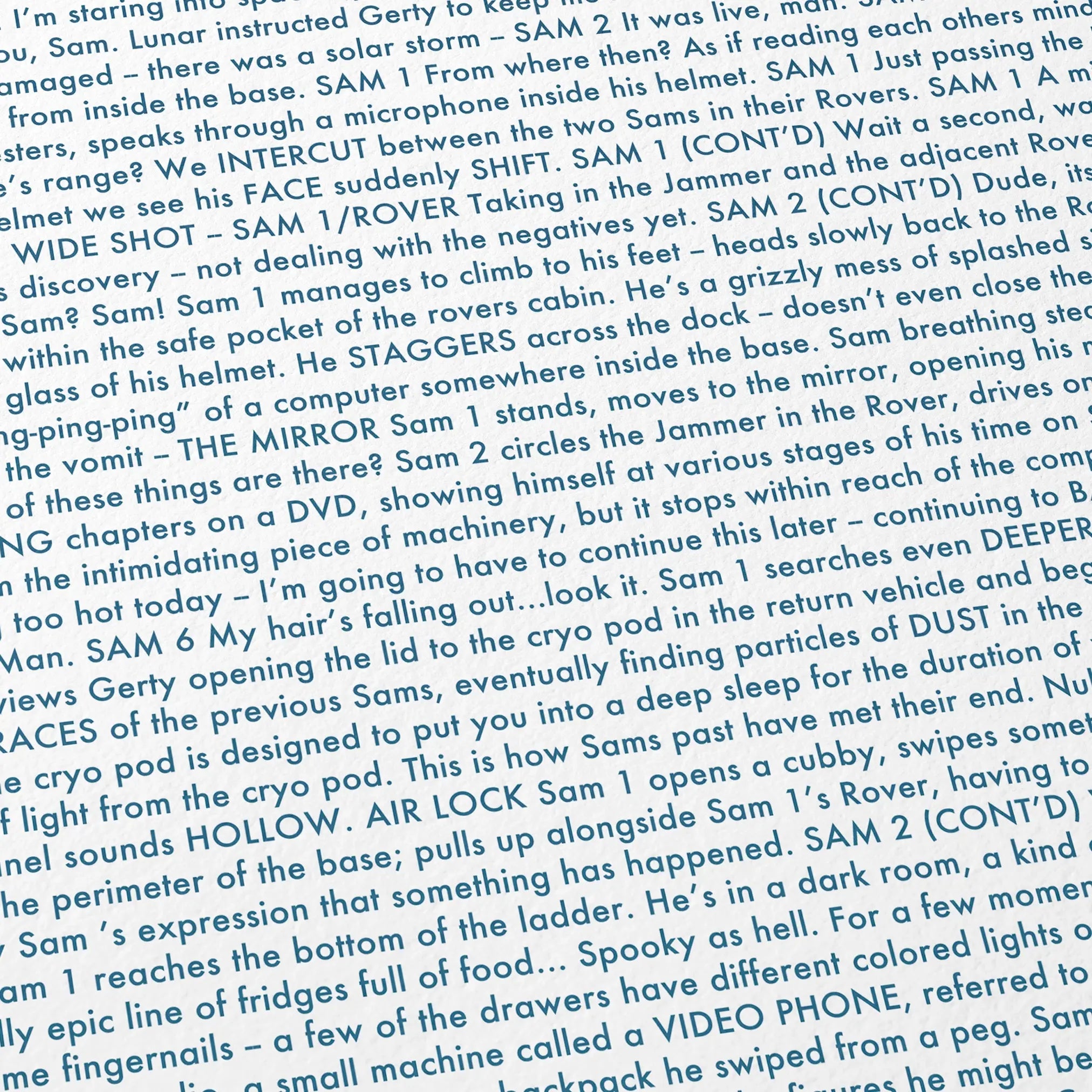 Close-up detail of the Moon movie script poster showing dense typographic text.