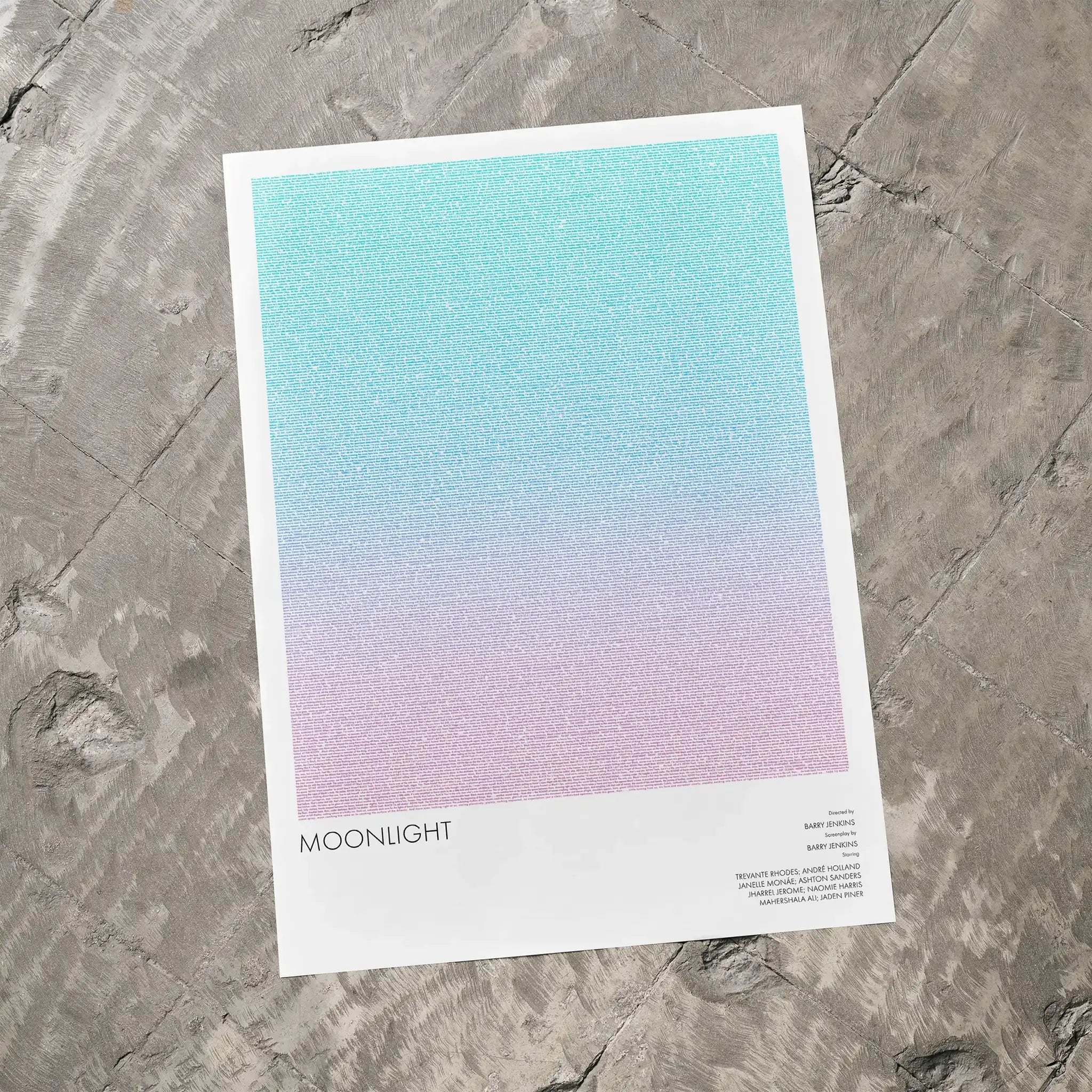 A Moonlight movie script poster laid flat on a textured floor surface.