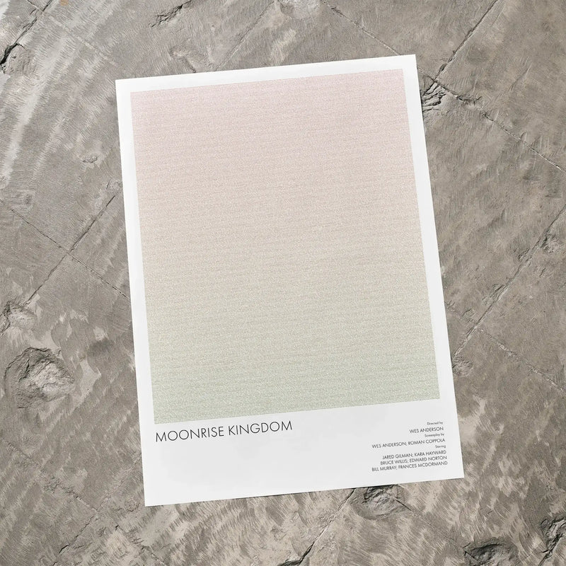 A Moonrise Kingdom movie script poster laid flat on a textured floor surface.