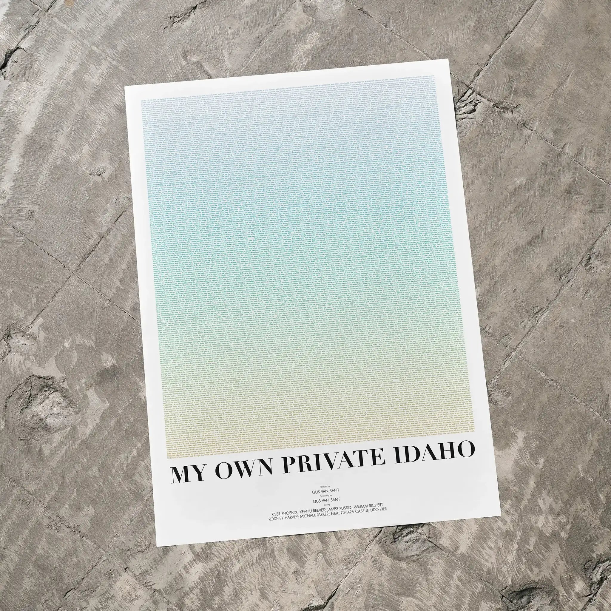 A My Own Private Idaho movie script poster laid flat on a textured floor surface.