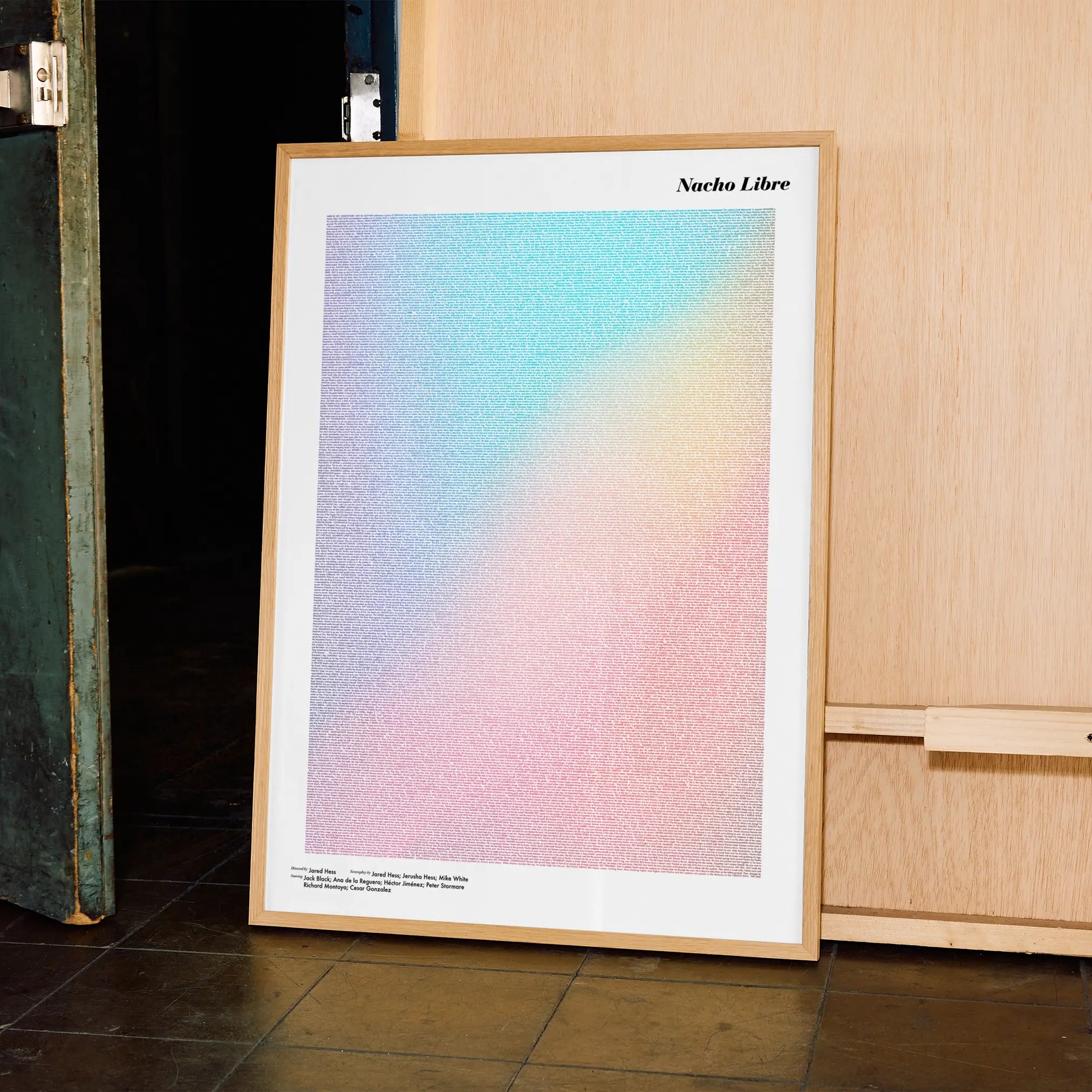 A framed Nacho Libre movie script poster displayed in a contemporary interior setting.
