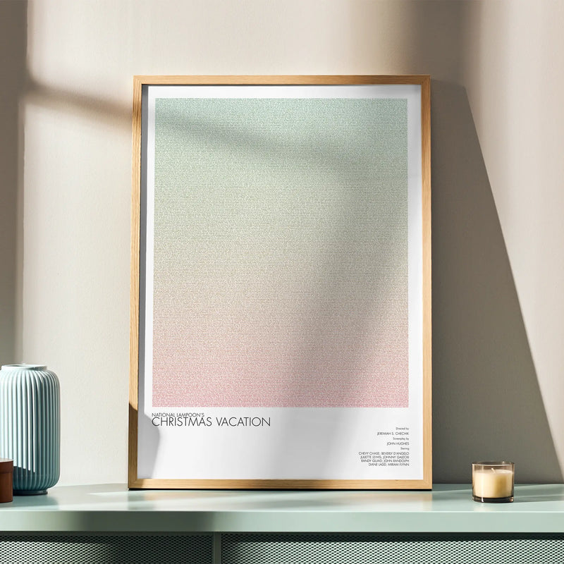 A framed National Lampoon's Christmas Vacation movie script poster displayed in a simple modern interior.