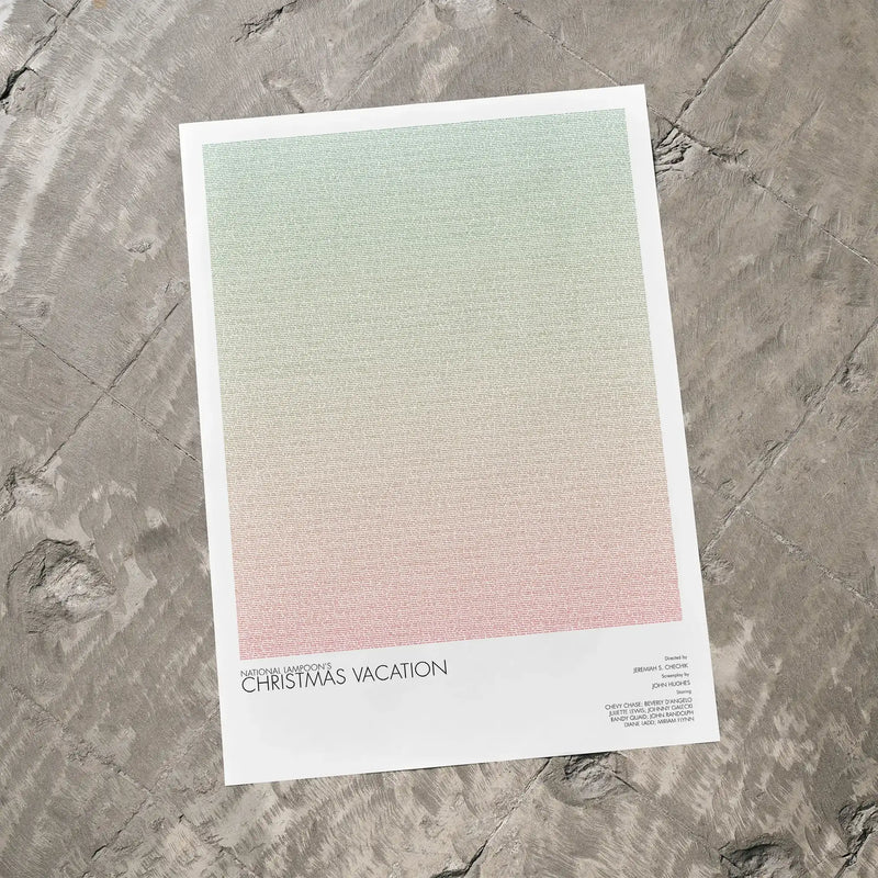 A National Lampoon's Christmas Vacation movie script poster laid flat on a textured floor surface.