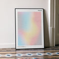 A framed Network movie script poster leaning against a wall in a minimalist interior.