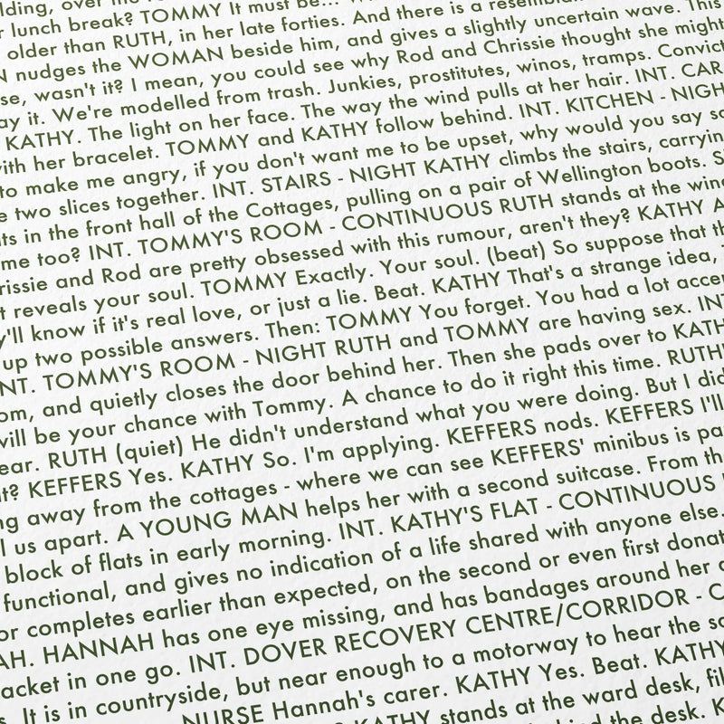 Close-up detail of the Never Let Me Go movie script poster showing dense typographic text.