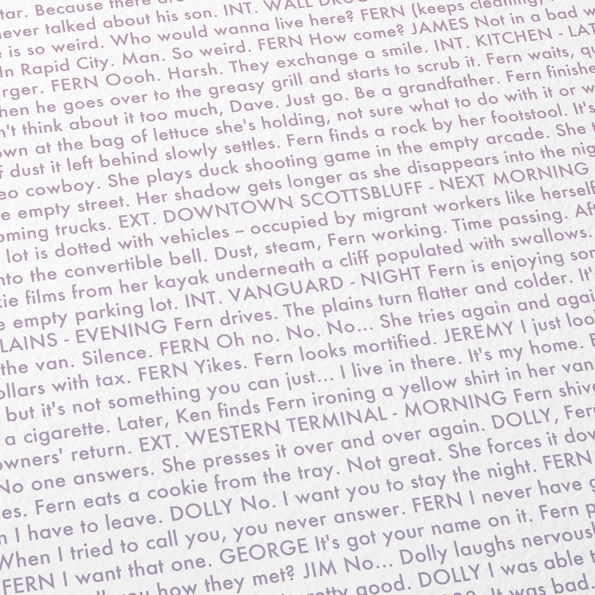 Close-up detail of the Nomadland movie script poster showing dense typographic text.