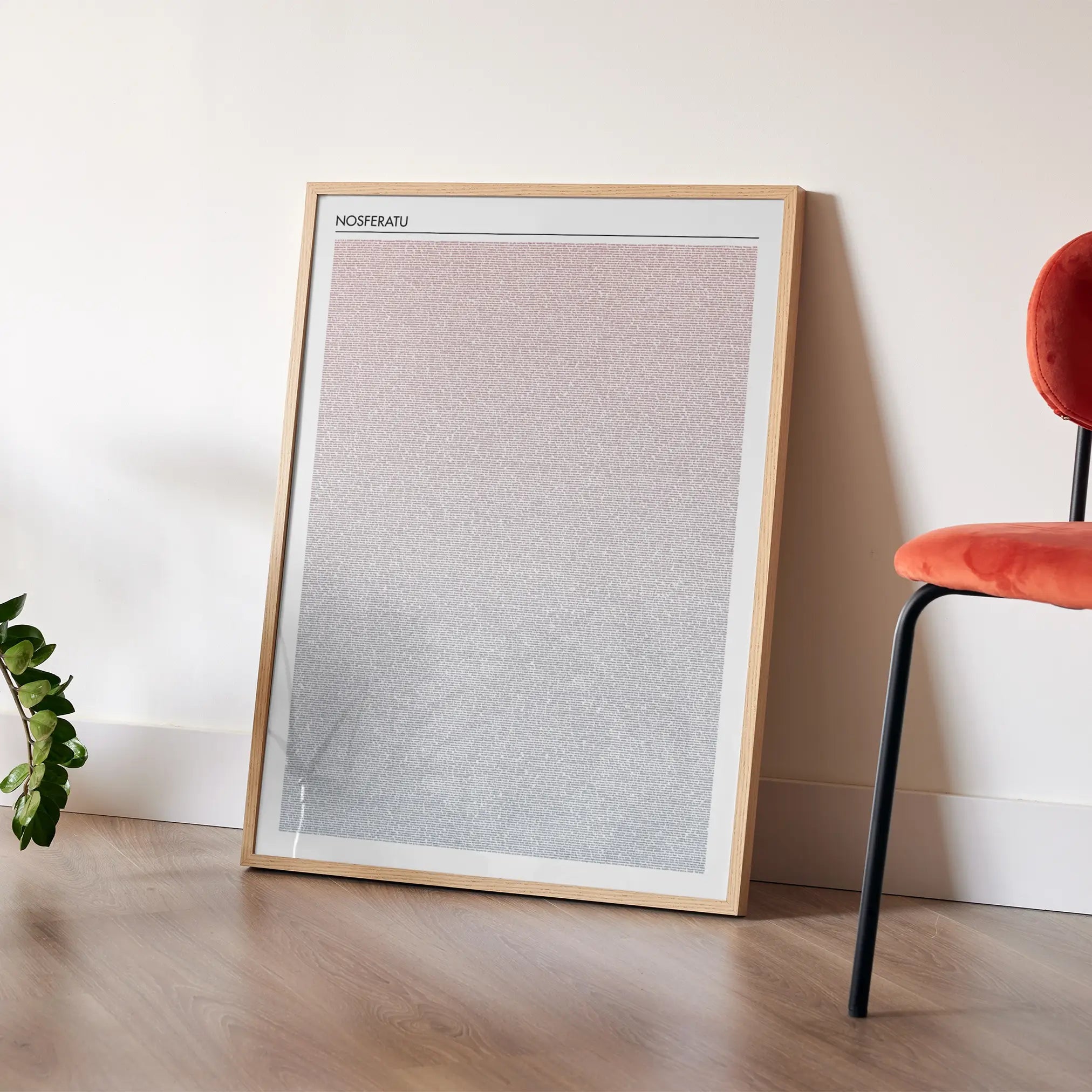 A framed Nosferatu movie script poster placed in a bright interior environment.