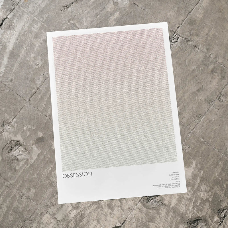 Print titled 'OBSSESSION' on a textured stone surface