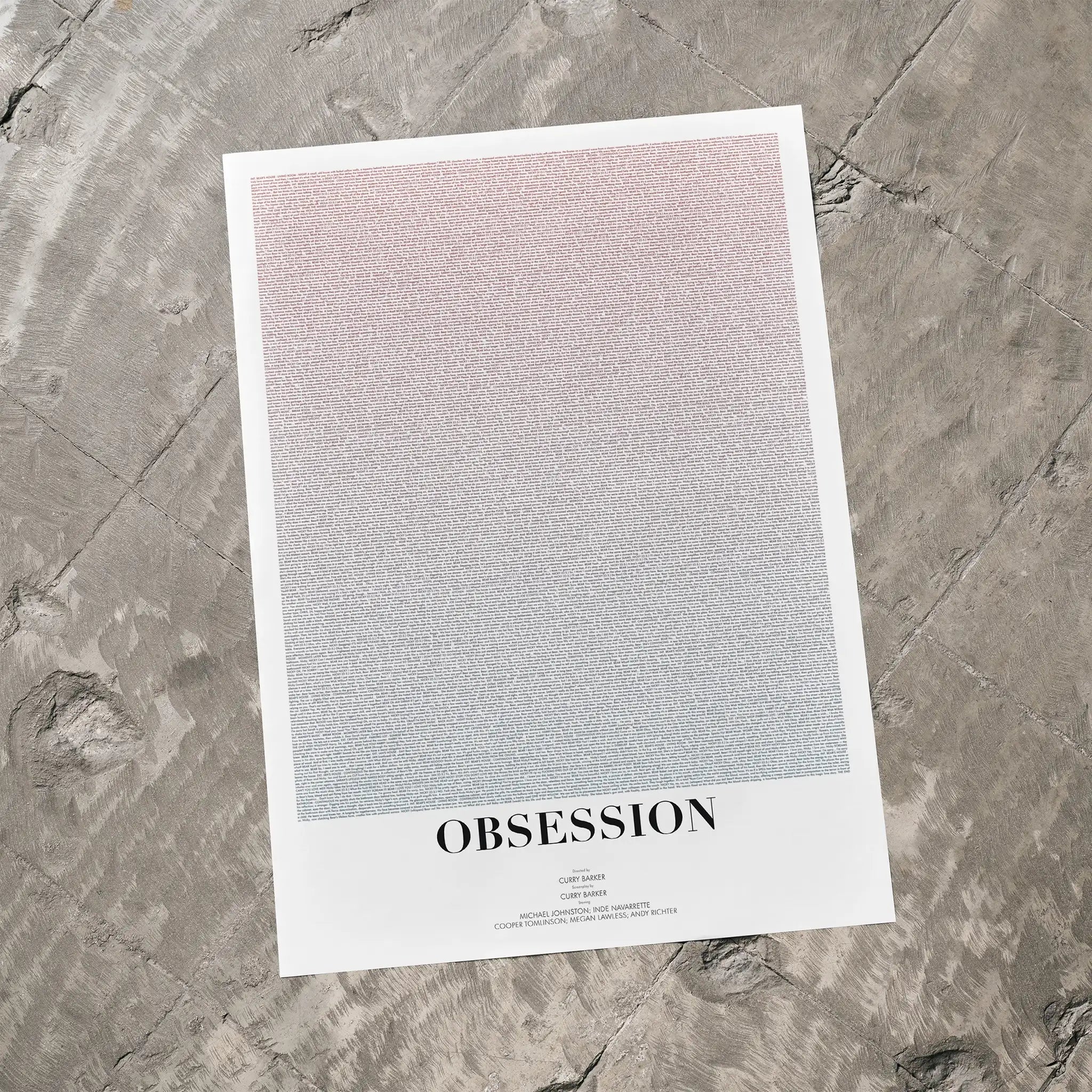 Poster with text 'OBSESSION' on a textured gray surface