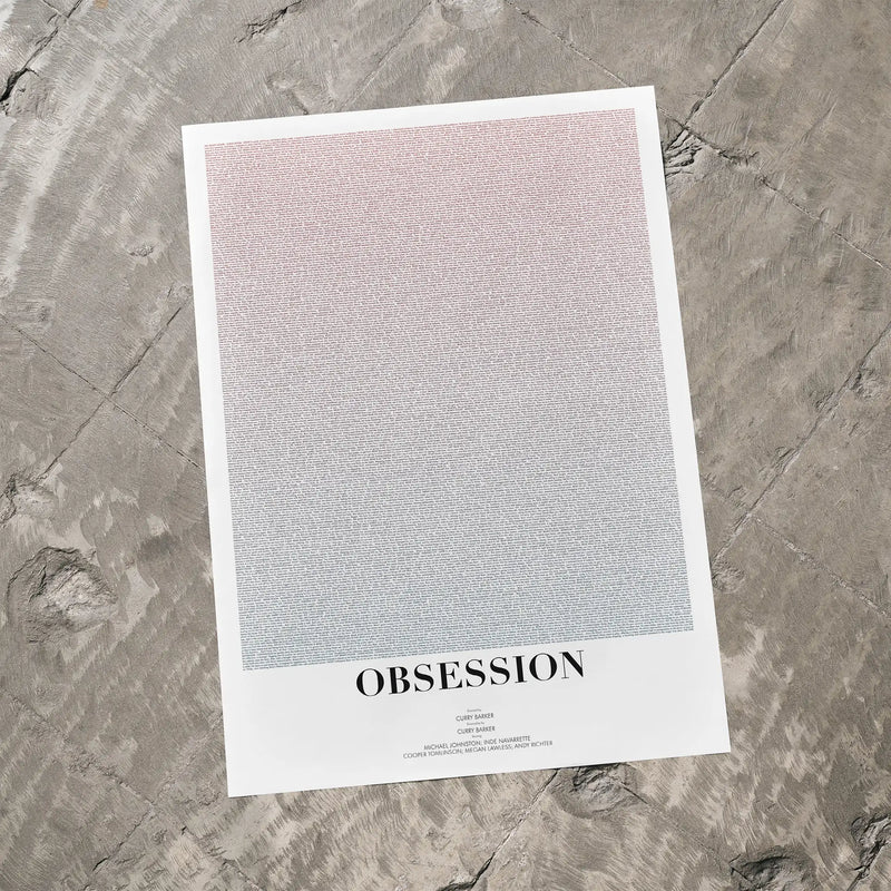 Poster with text 'OBSESSION' on a textured gray surface