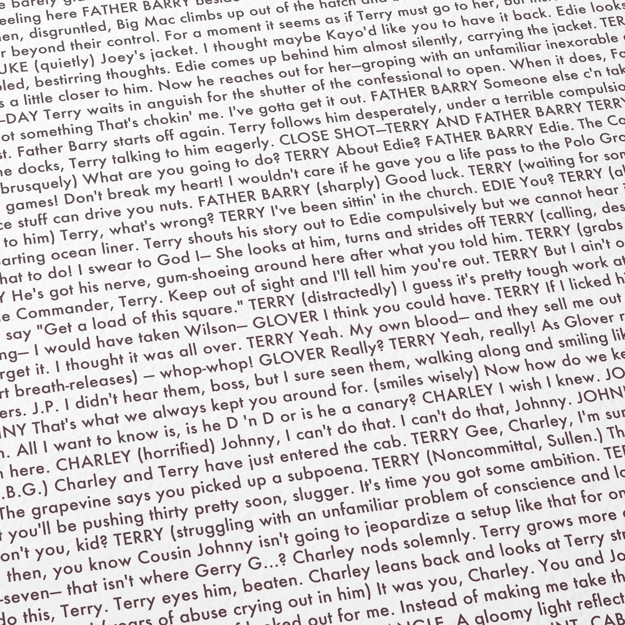 Close-up detail of the On the Waterfront movie script poster showing dense typographic text.