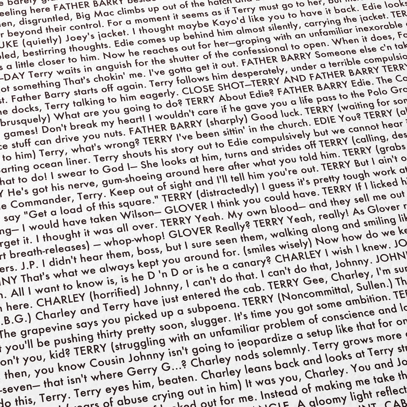 Close-up detail of the On the Waterfront movie script poster showing dense typographic text.