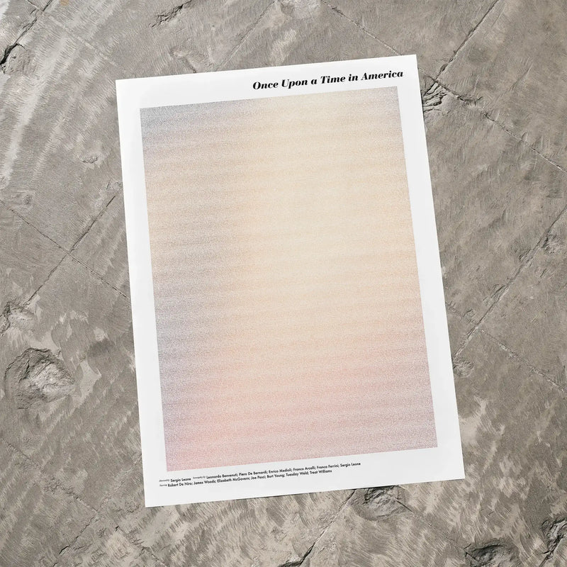 A Once Upon a Time in America movie script poster laid flat on a textured floor surface.