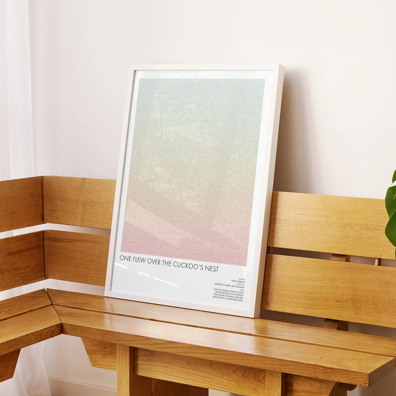 A framed One Flew Over the Cuckoo's Nest movie script poster displayed on a sideboard in a contemporary space.