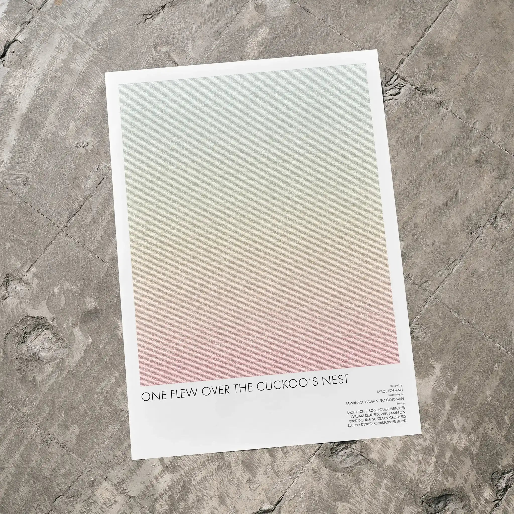 A One Flew Over the Cuckoo's Nest movie script poster laid flat on a textured floor surface.