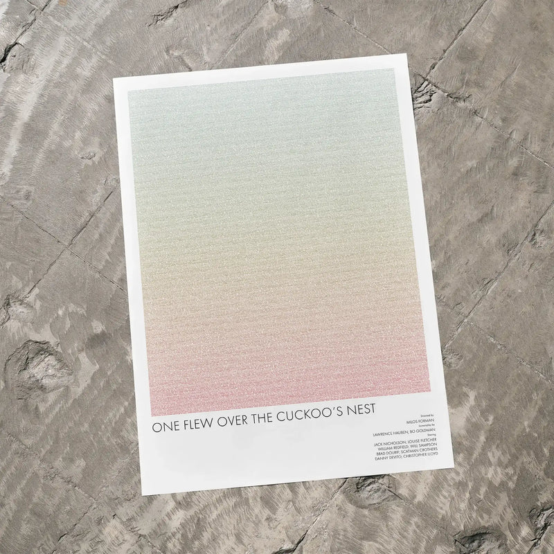 A One Flew Over the Cuckoo's Nest movie script poster laid flat on a textured floor surface.