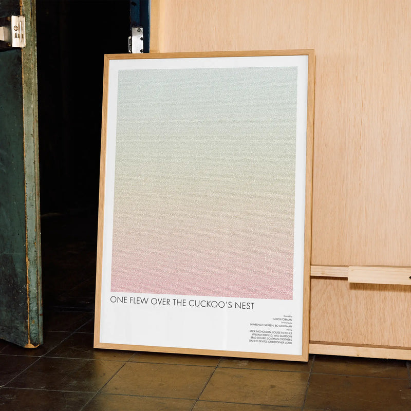 A framed One Flew Over the Cuckoo's Nest movie script poster displayed in a contemporary interior setting.